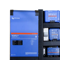 Close-up of MultiPlus-II inverter and MPPT solar controller mounted on black board