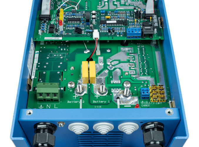 Internal view of Victron Phoenix battery charger showing main terminals and circuit board
