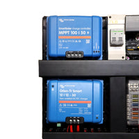 Close-up of stacked Victron SmartSolar MPPT and Orion-Tr Smart units on board