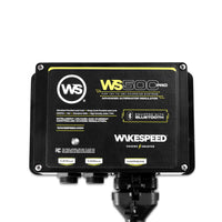 Wakespeed WS500 Pro alternator regulator with wiring harness attached on black background