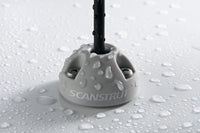 Close-up of light grey Scanstrut cable seal with water droplets demonstrating IP rating