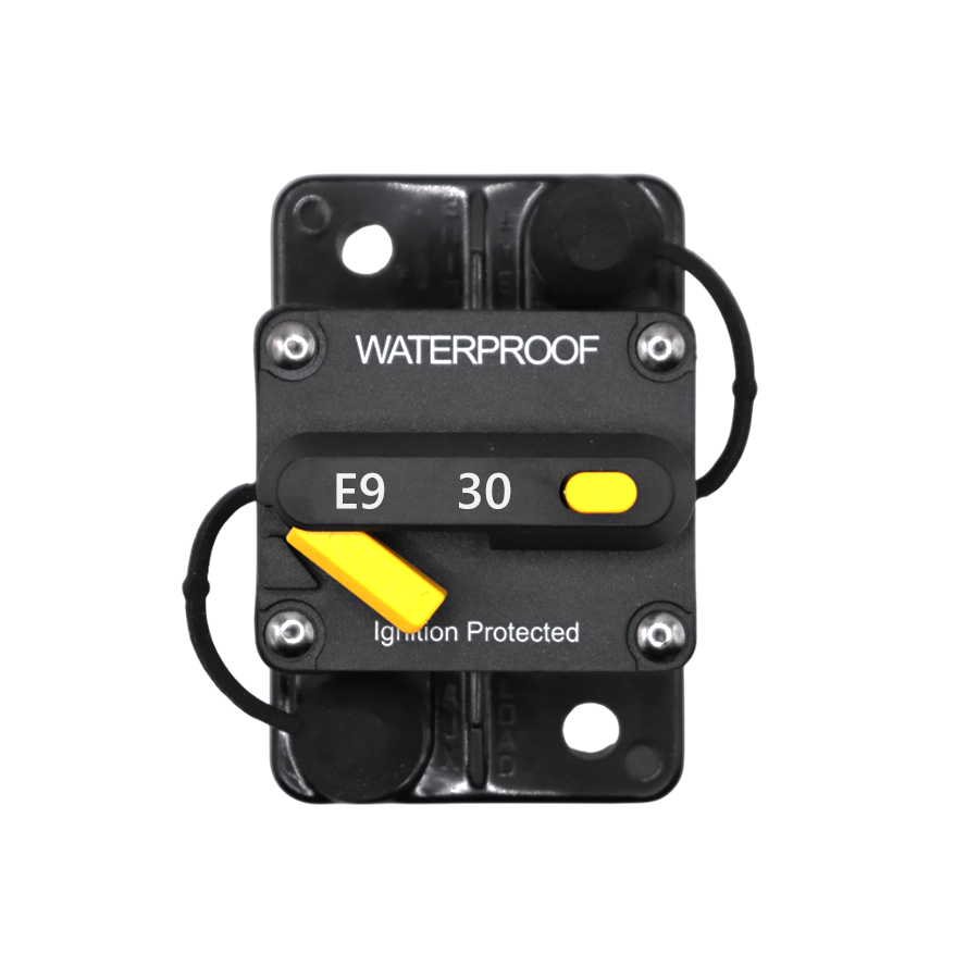 Top view of 30A waterproof circuit breaker with yellow reset lever and protective caps