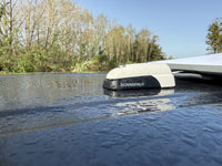 Waterproof cable seal on a wet textured surface demonstrating IP68 protection