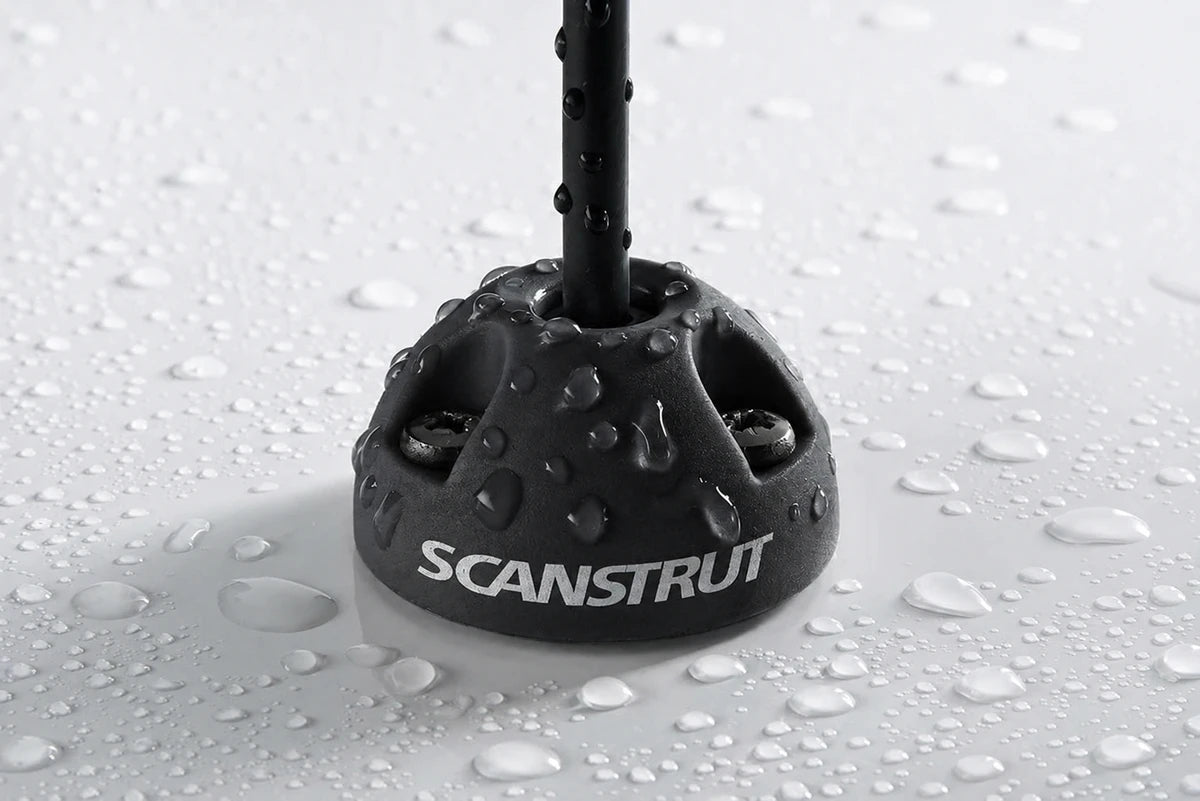 Water droplets on a black Scanstrut cable seal demonstrating its waterproof rating