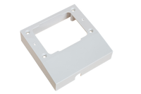 White plastic mounting spacer for C Type GPO with central cutout and pre-drilled mounting holes