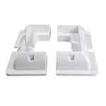 Set of four white ABS plastic corner brackets for solar panel mounting arranged in a square