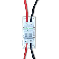 Top-down view of circuit breaker wired with red and black cables