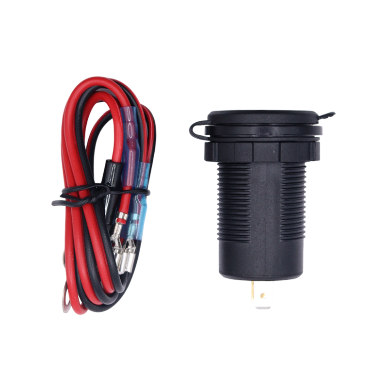 Socket with closed protective cap lying next to the coiled red and black wiring harness